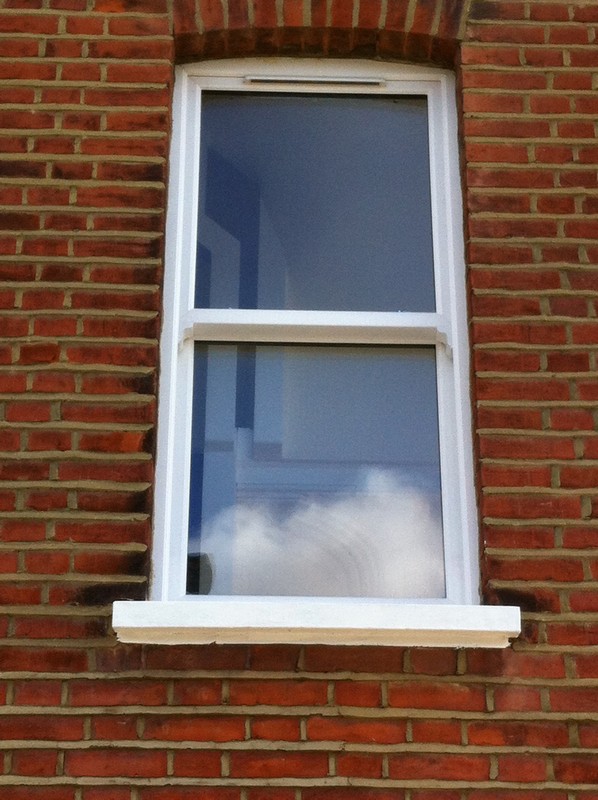 uPVC sash window on Victorian red brick house in Olney